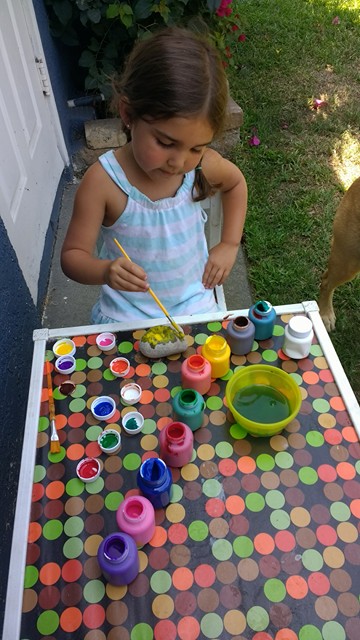 Child painting rock 