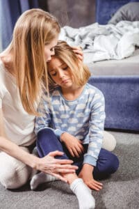 mom talking to daughter about the death of a grandparent