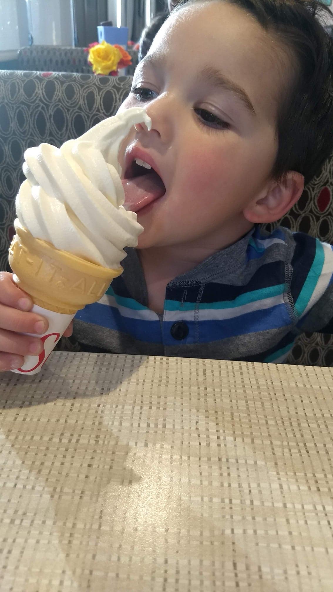 little boy eating chick fil a ice cream