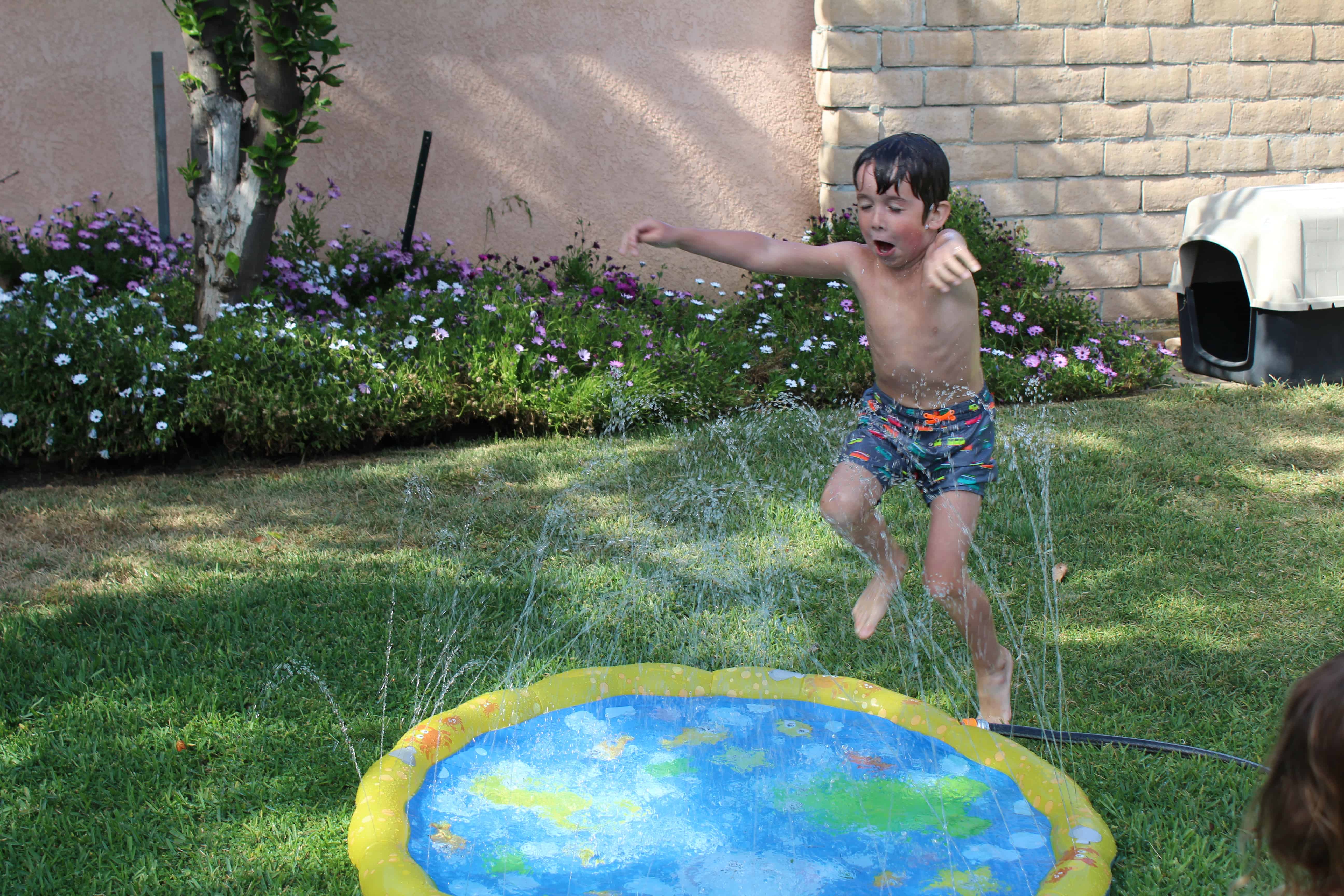 Child running through a splash pad