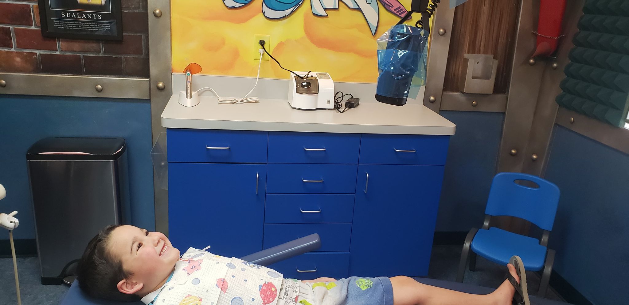 little boy in a toddler dentist office
