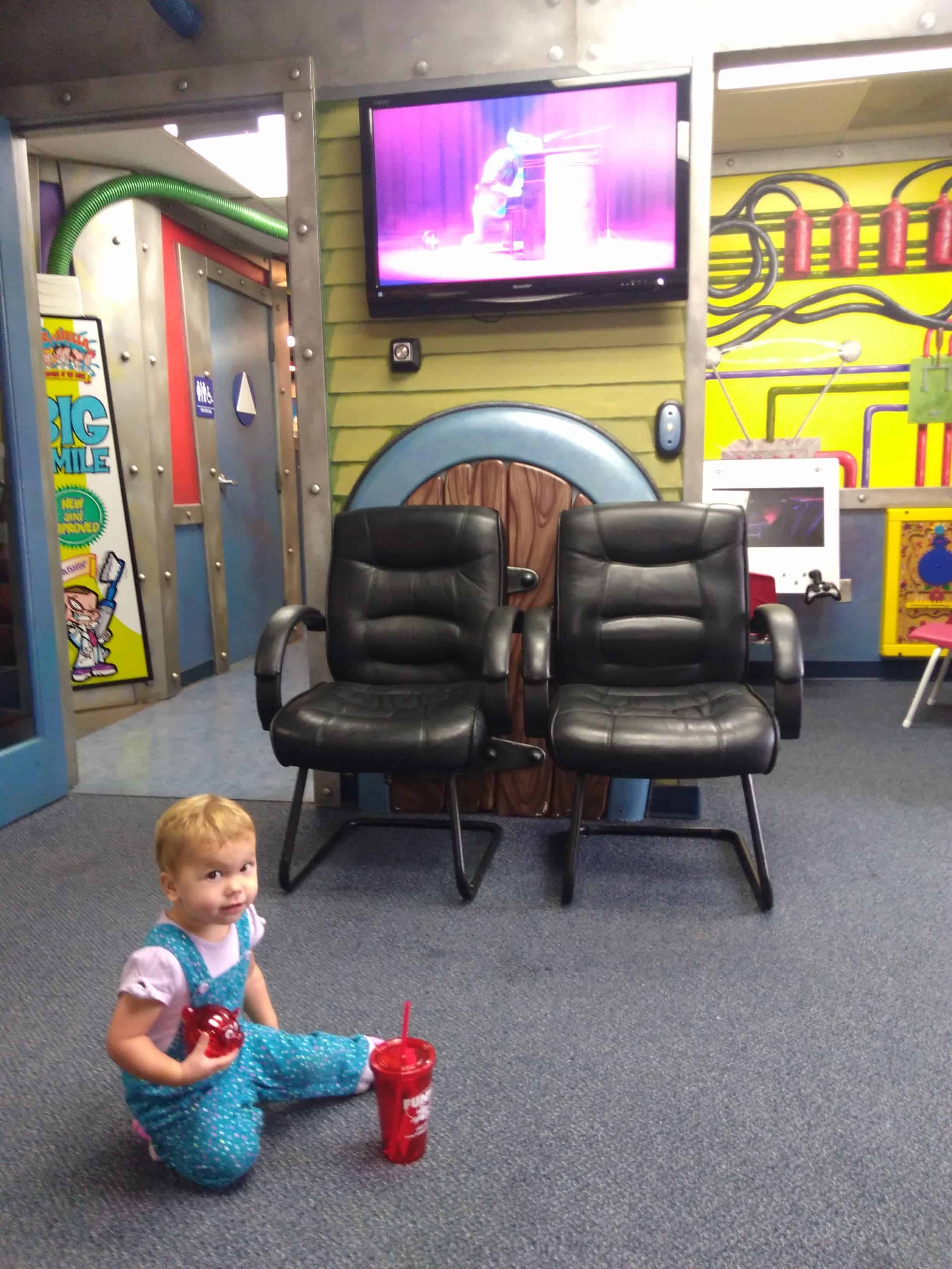 toddler in a kid-friendly dentist office