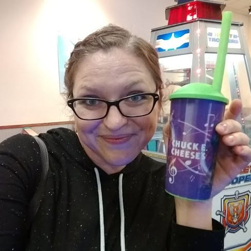 Salty Momma Jaymi holding a Chuck E Cheese refillable cup