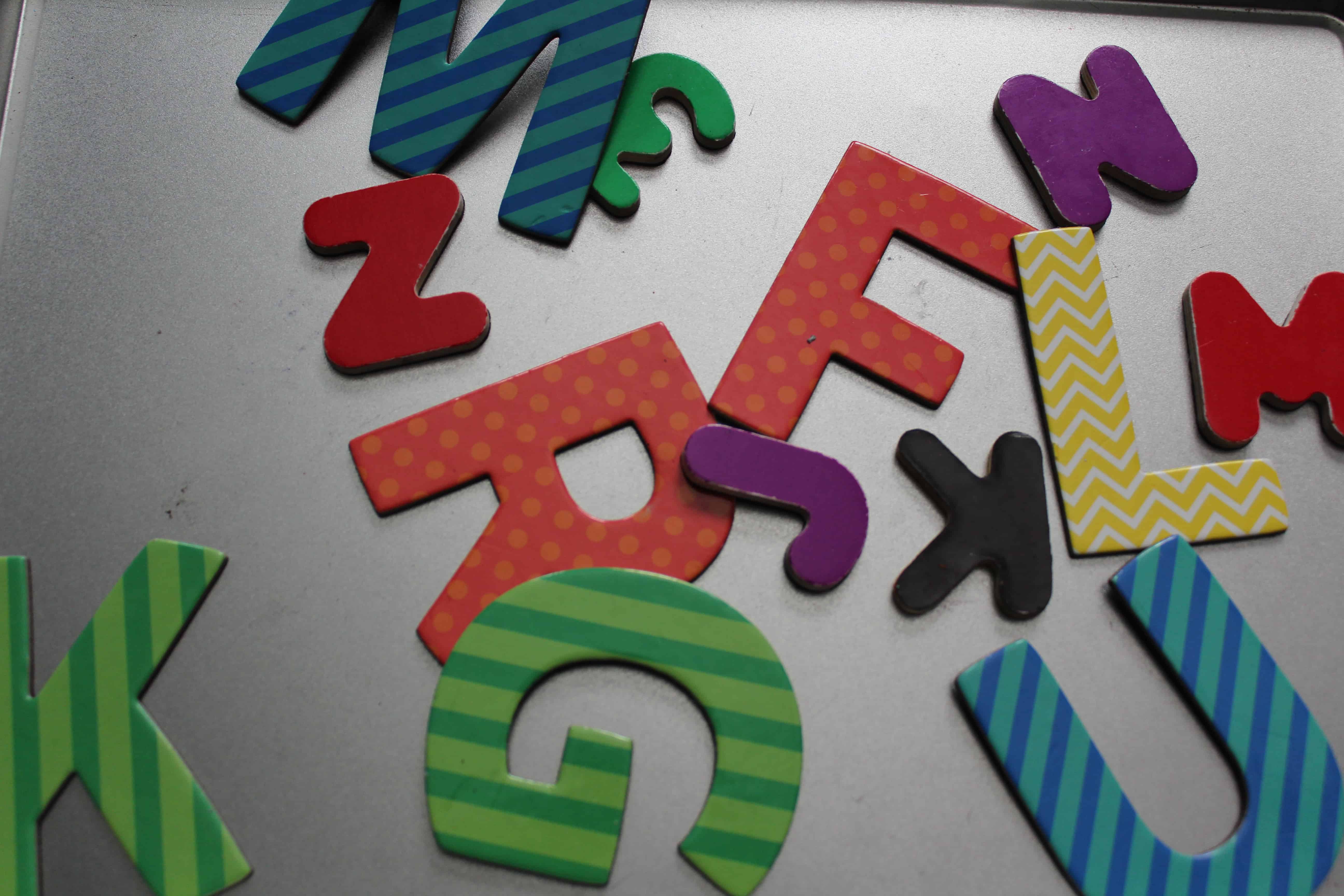 Letter magnet cutouts on a baking sheet