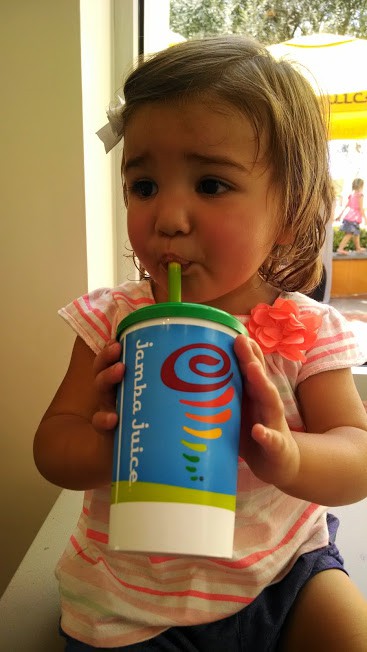 toddler drinking iron-rich smoothie