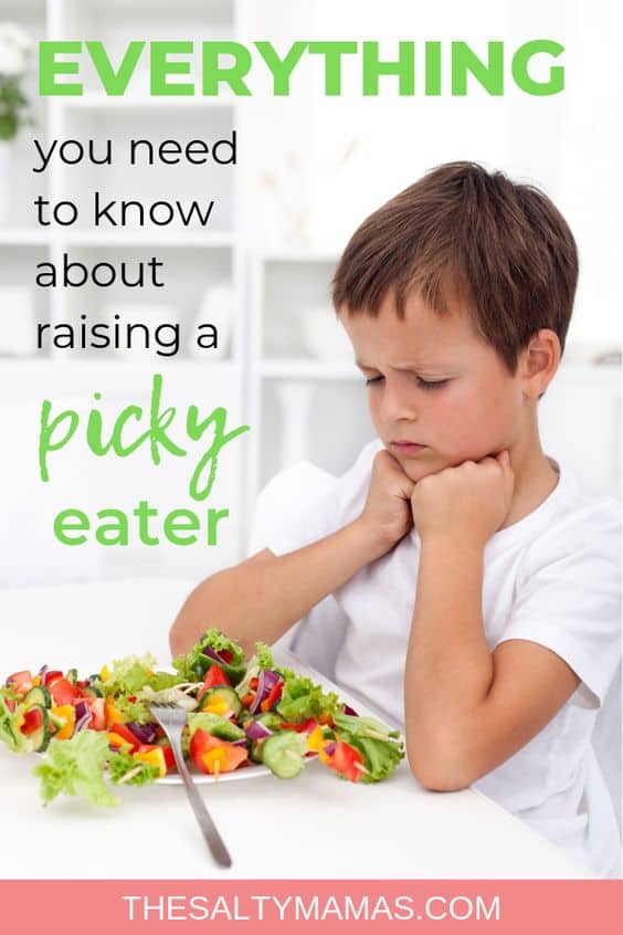 picky eater frowning at a salad