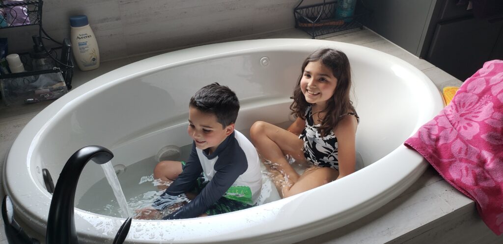 kids in suits in a bath tub