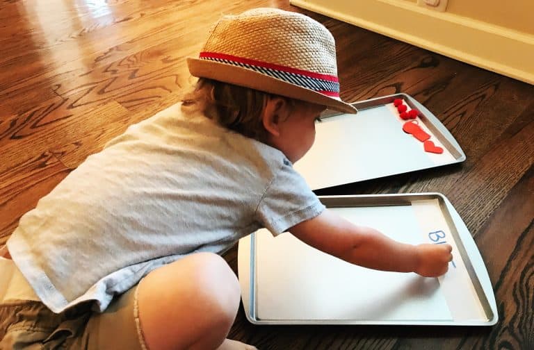 Baking sheets with magnets while a child sorts. 