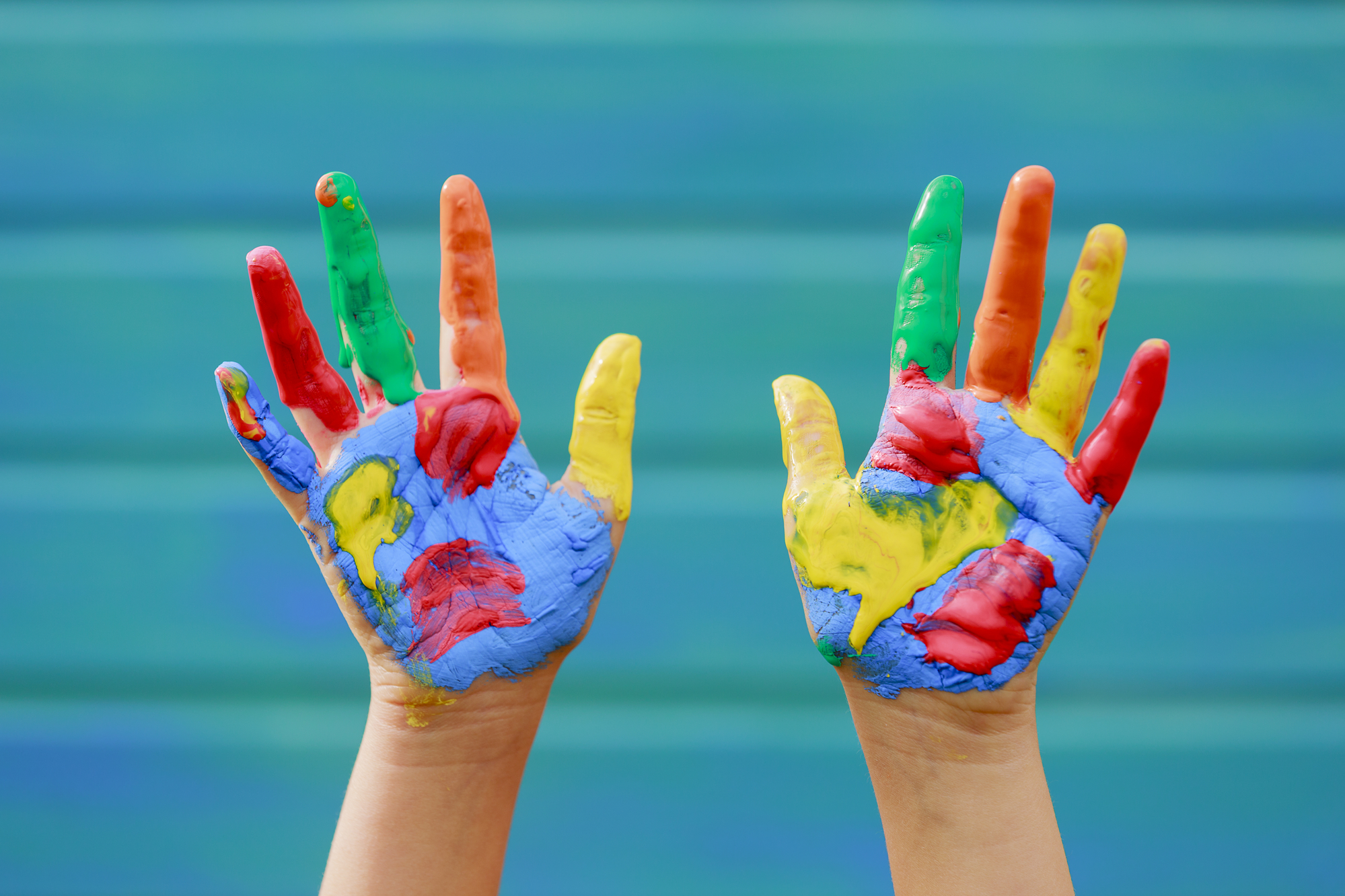 toddler hands with paint on them