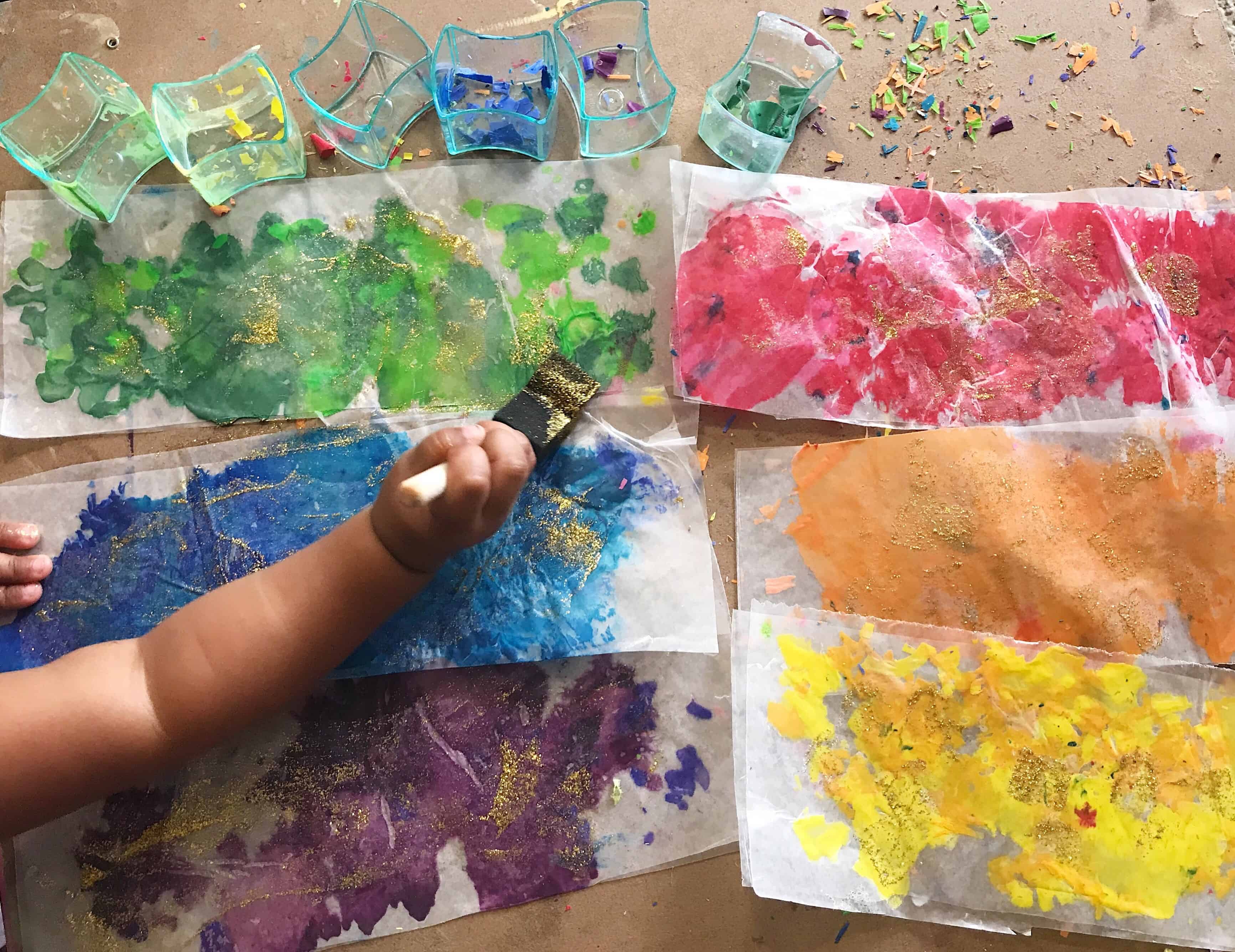 Melted crayon panted onto parchment paper by toddler.