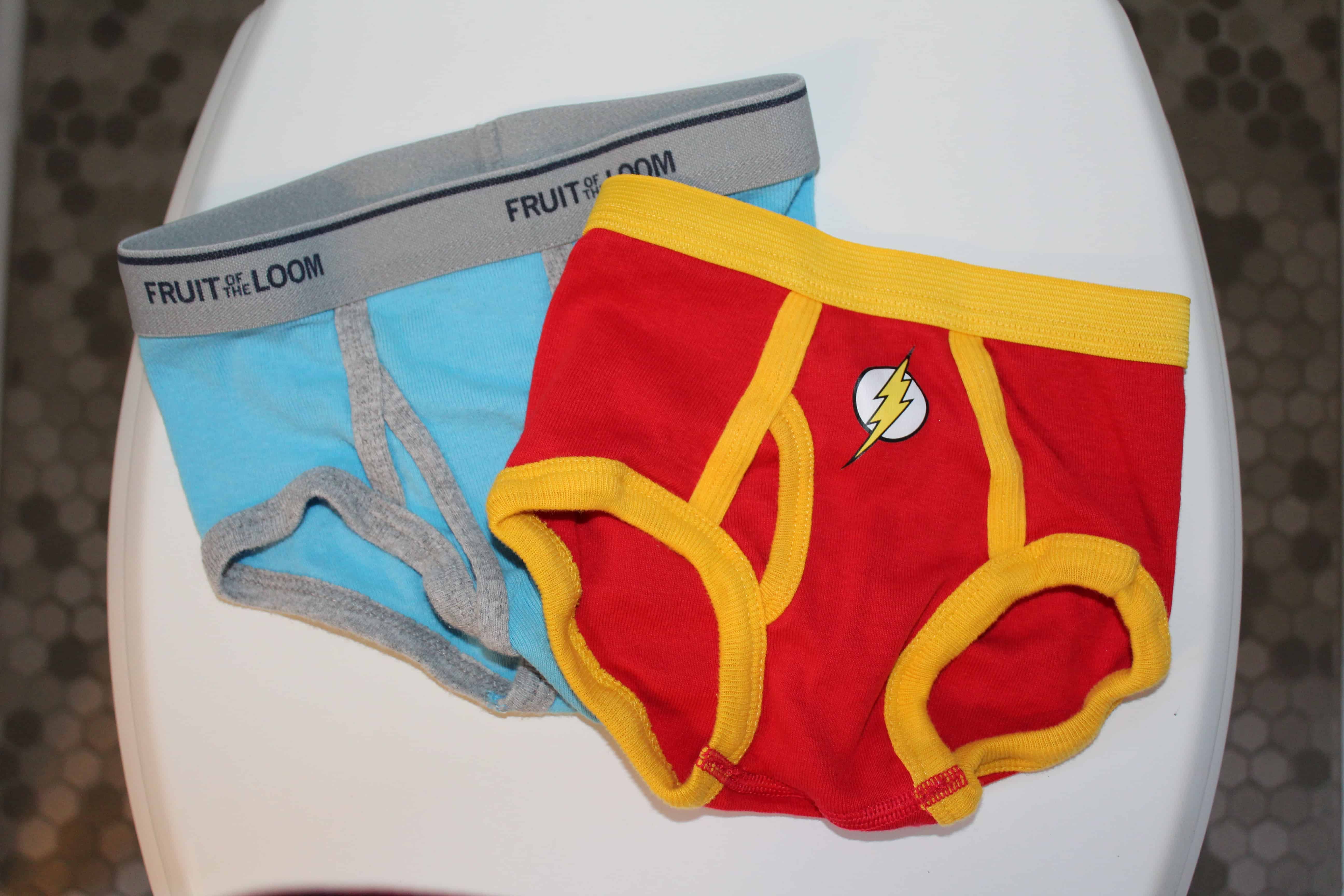 Red and Yellow Superhero Flash boy underwear and a baby blue Fruit of the loom pair of boys underwear.