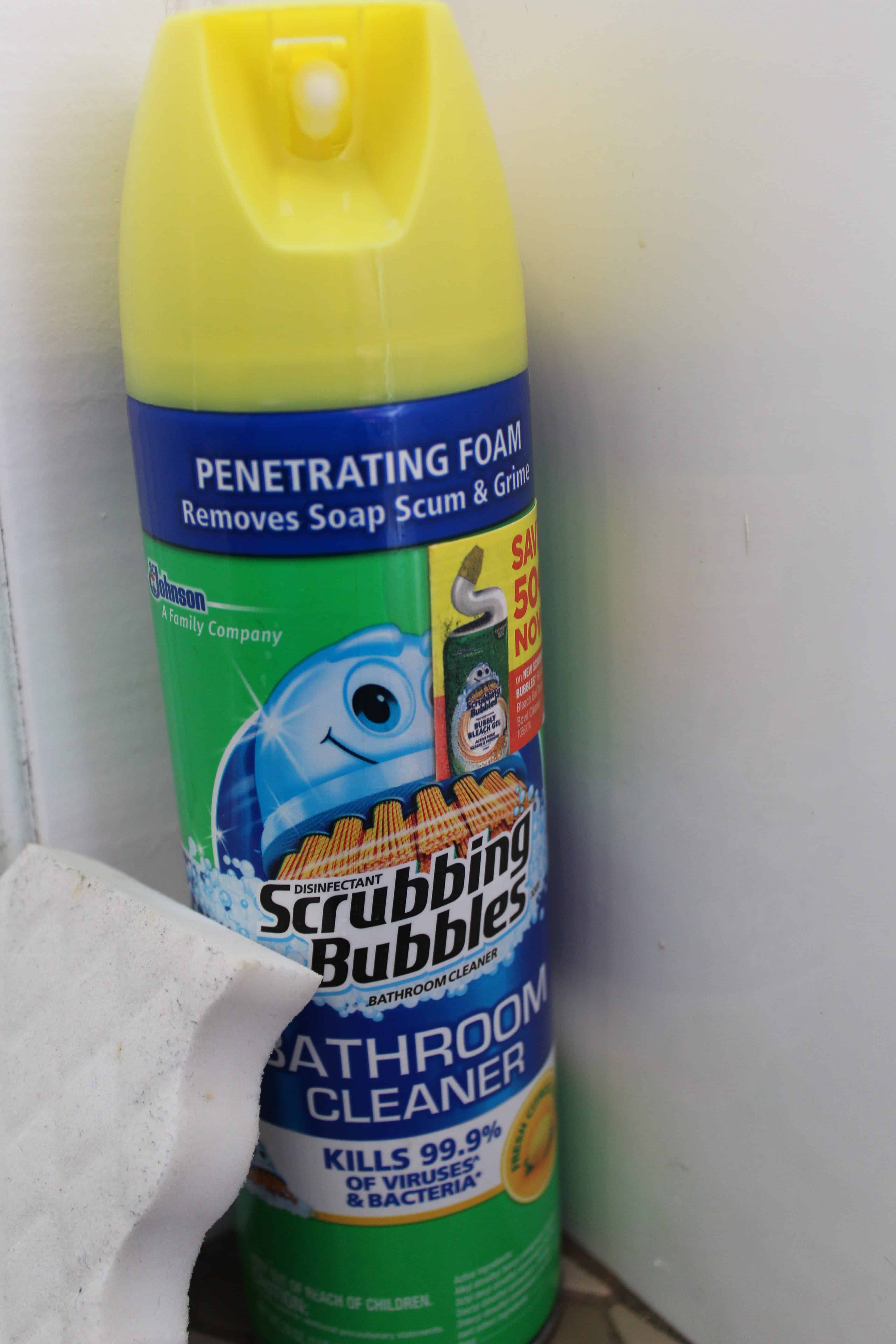 Cannisters of scrubbing bubbles bathroom cleaner and a magic eraser.