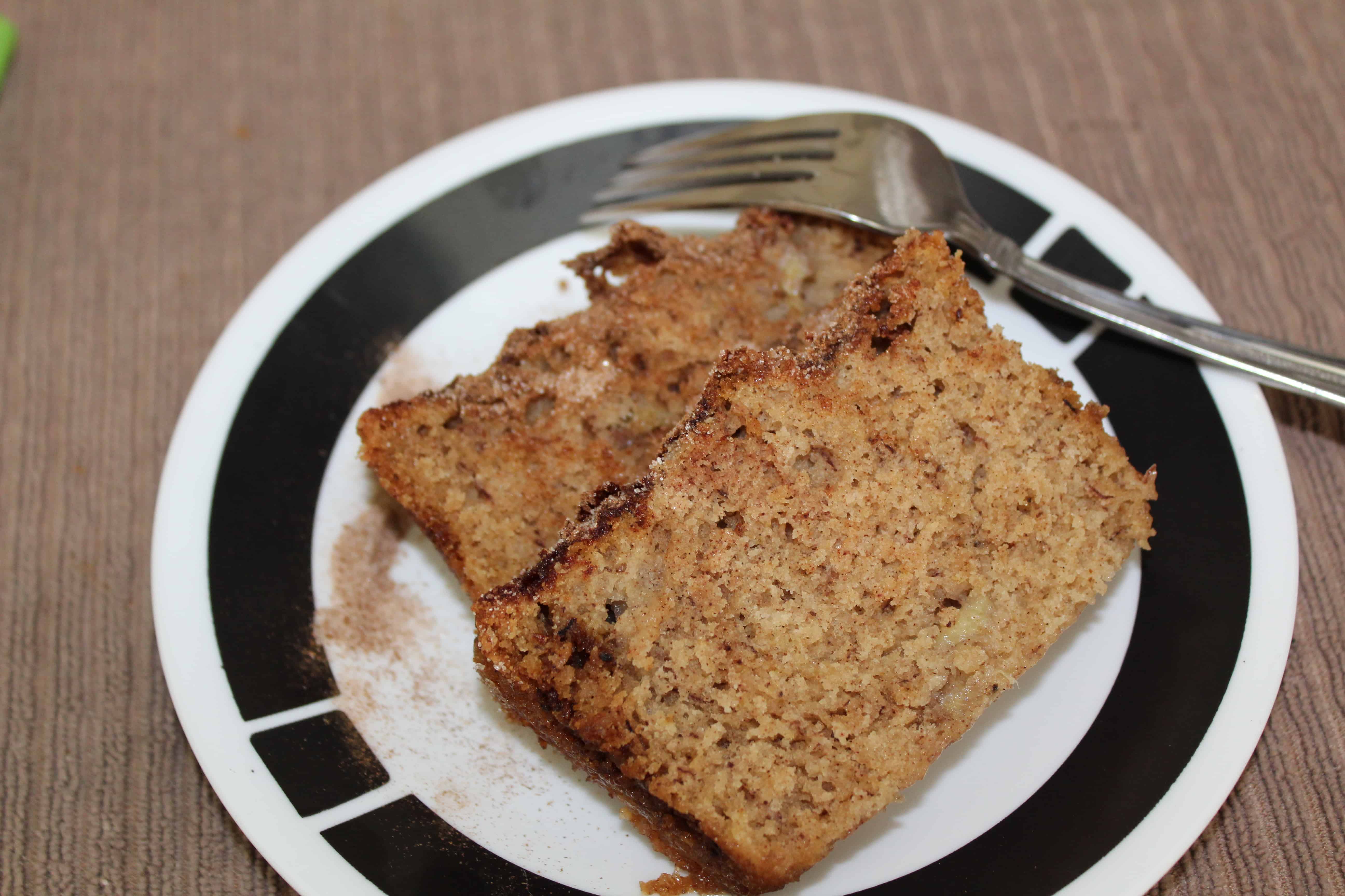 Two slices of banana bread on a plate. 