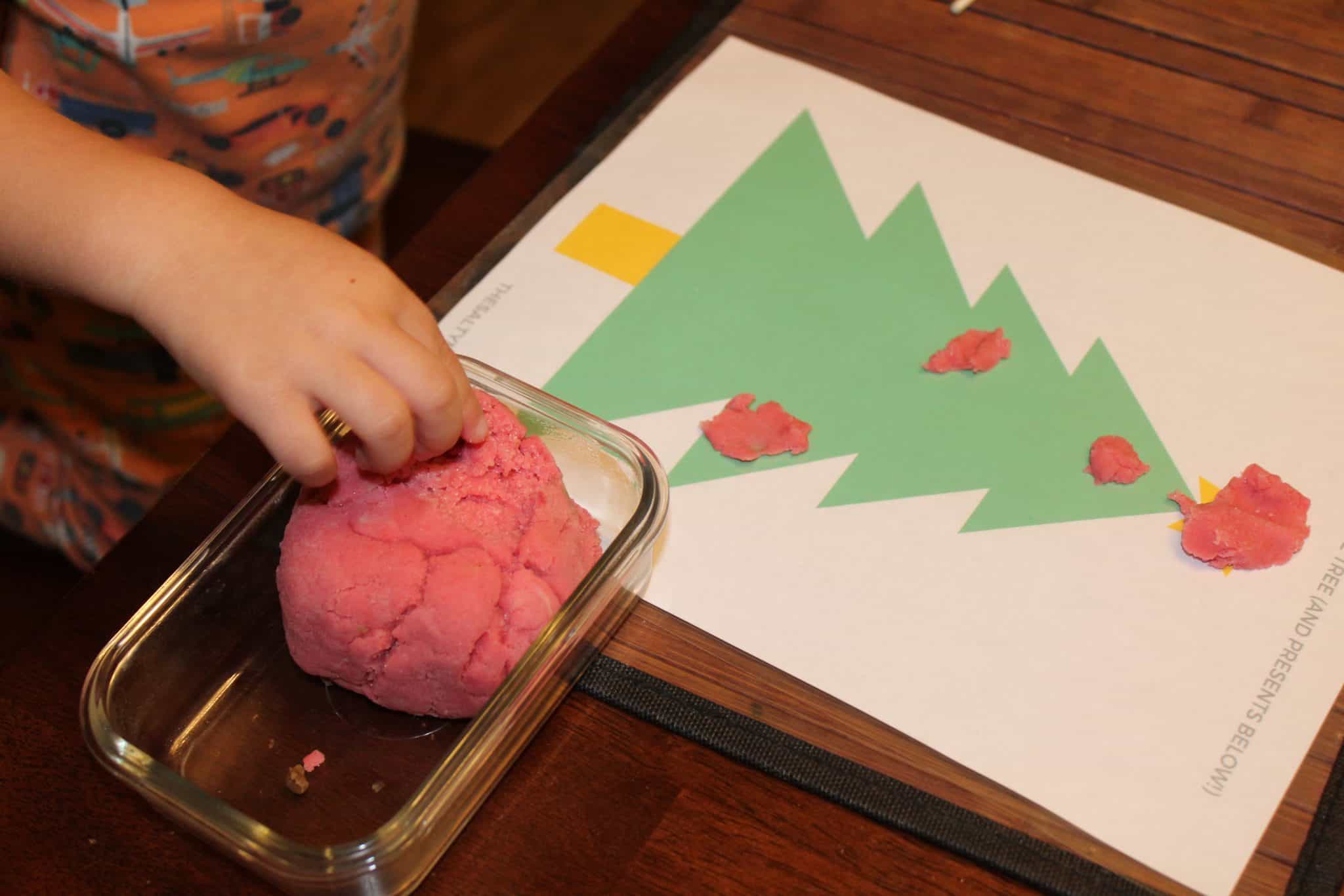 We've got a fresh take on holiday playdough activities for toddlers! From Christmas playdough to a homemade Gingerbread playdough recipe, and from Hannukah playdough mats to a pretend play center, we've got your holiday sensory play covered. Find the full list of activities at TheSaltyMamas.com. #holidays #christmas #toddleractivities #hannukahactivitiesforkids #christmasactivitiesforkids #christmasplaydough #gingerbreadplaydough #peppermintplaydough #playdoughcenters