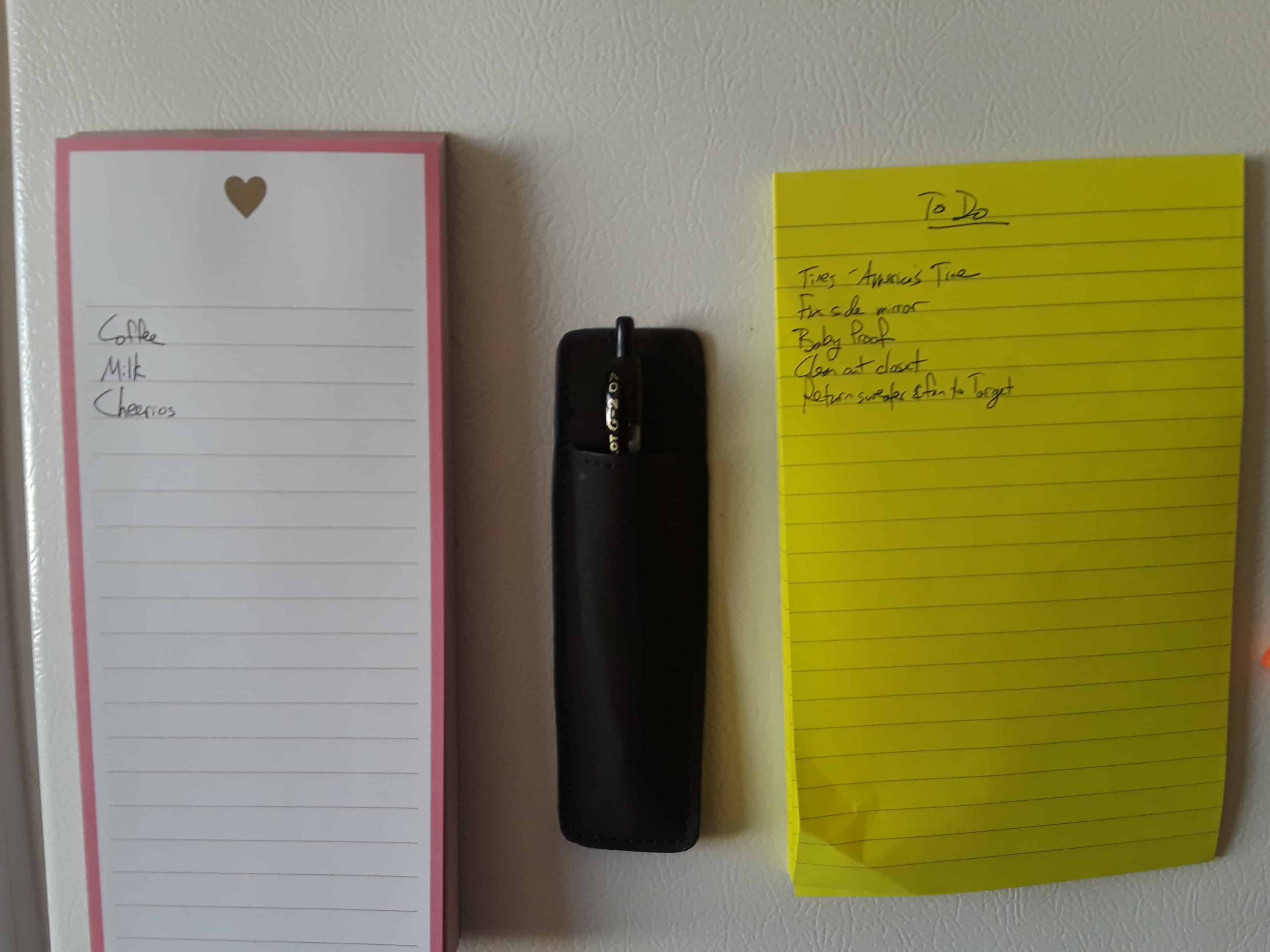 Two notepads and a magnetic pencil cup holder.