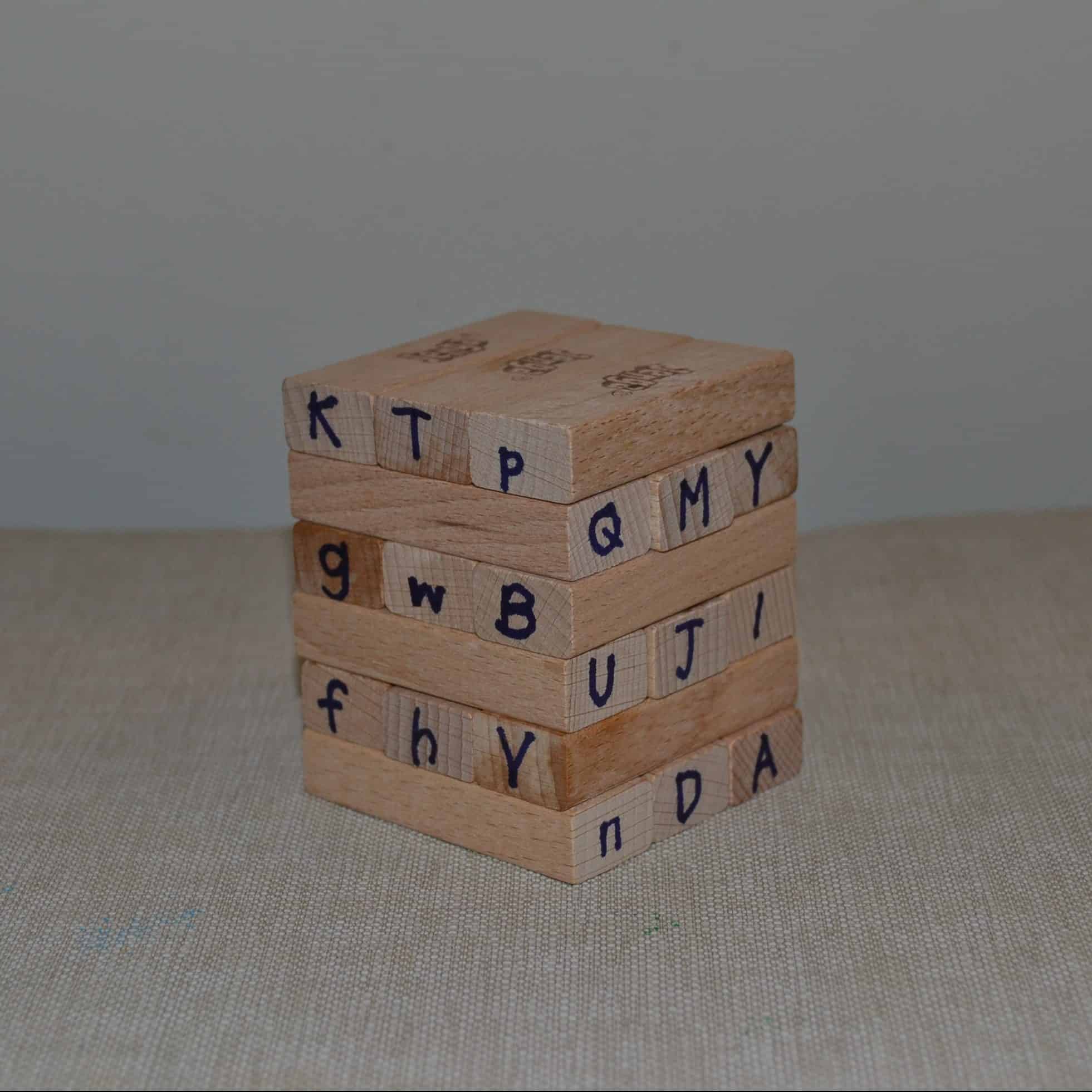 jenga blocks with letters written on them