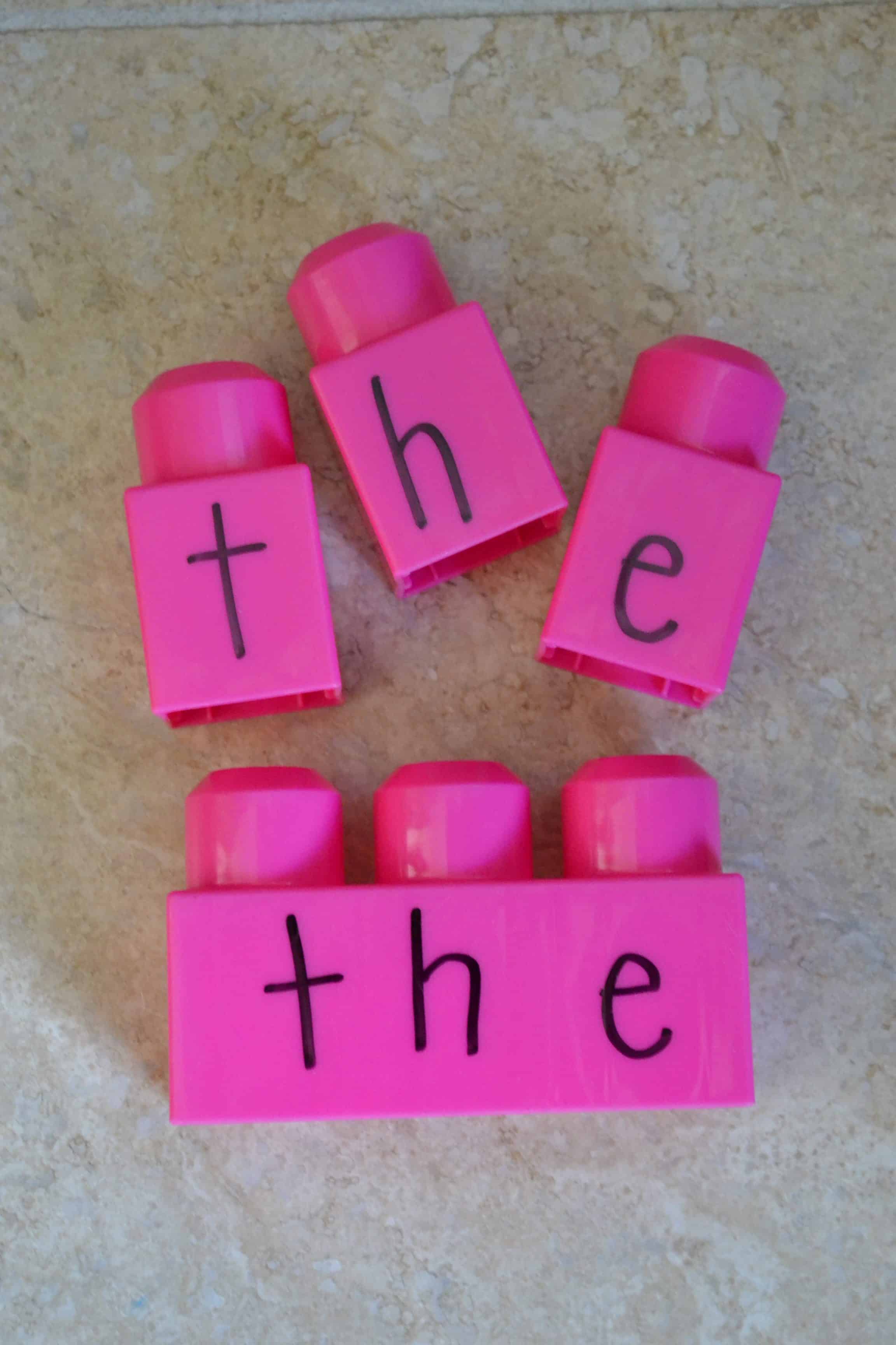 duplo blocks with letters spelling "the"