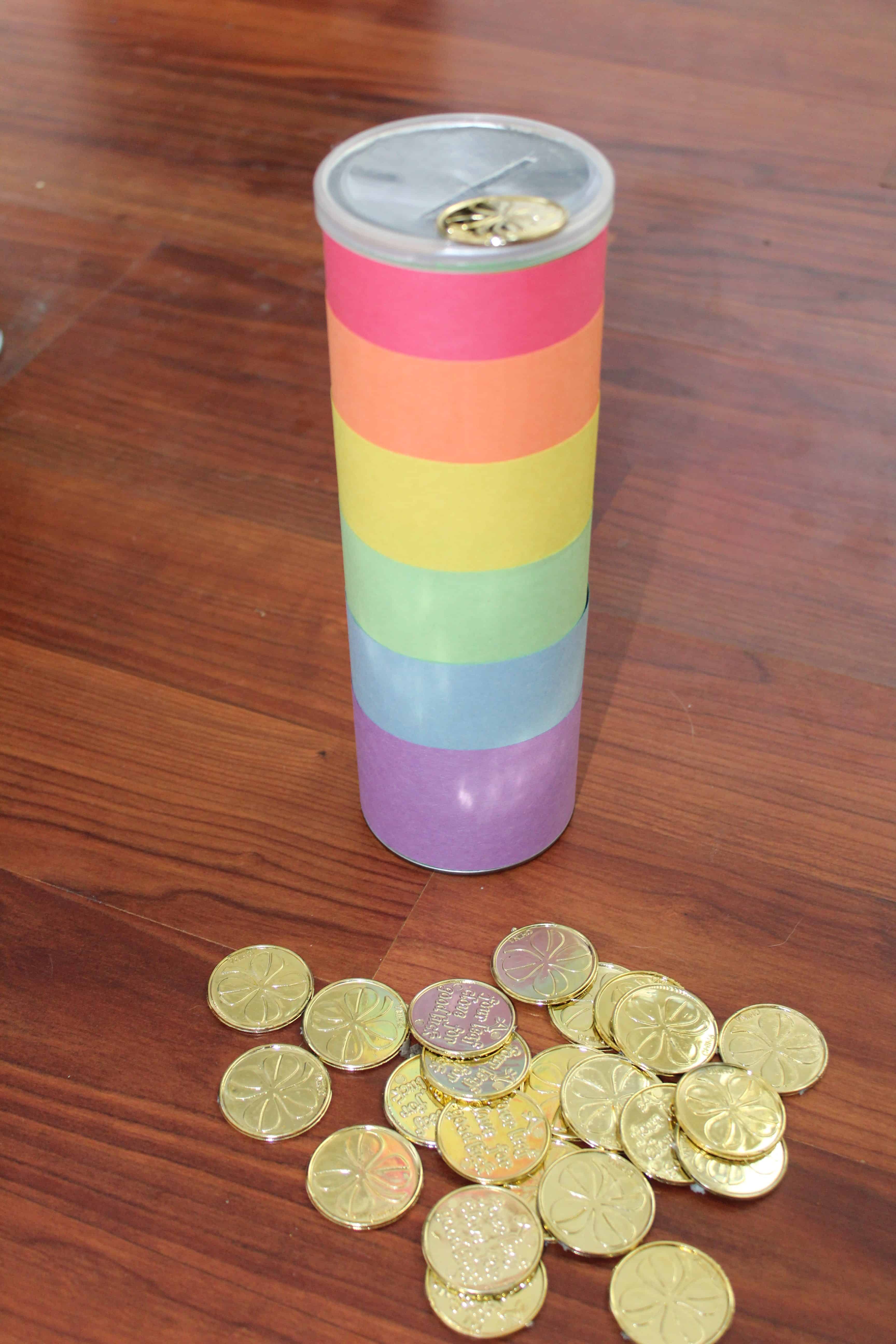 can decorated like a rainbow; slit in lid to drop gold coins into