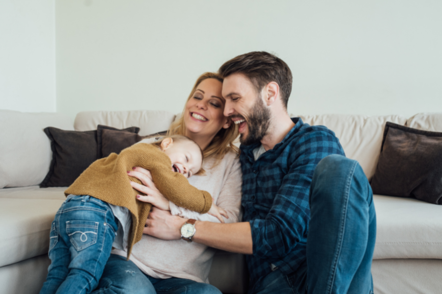 toddler hugging mom and dad