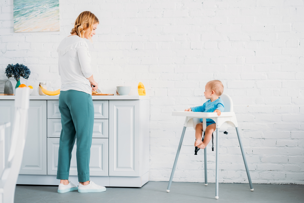 baby making dinner with mom