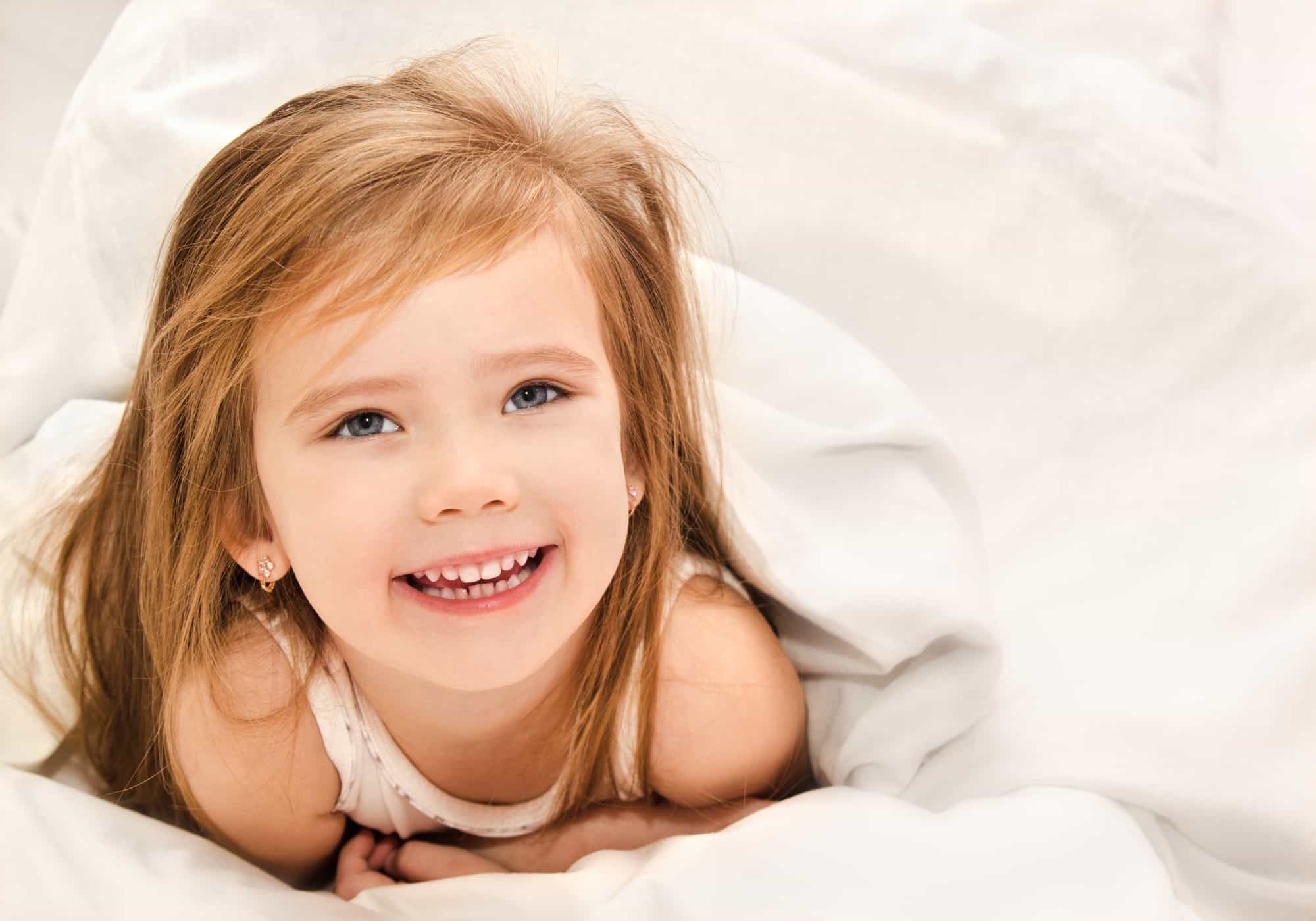 toddler happy in bed