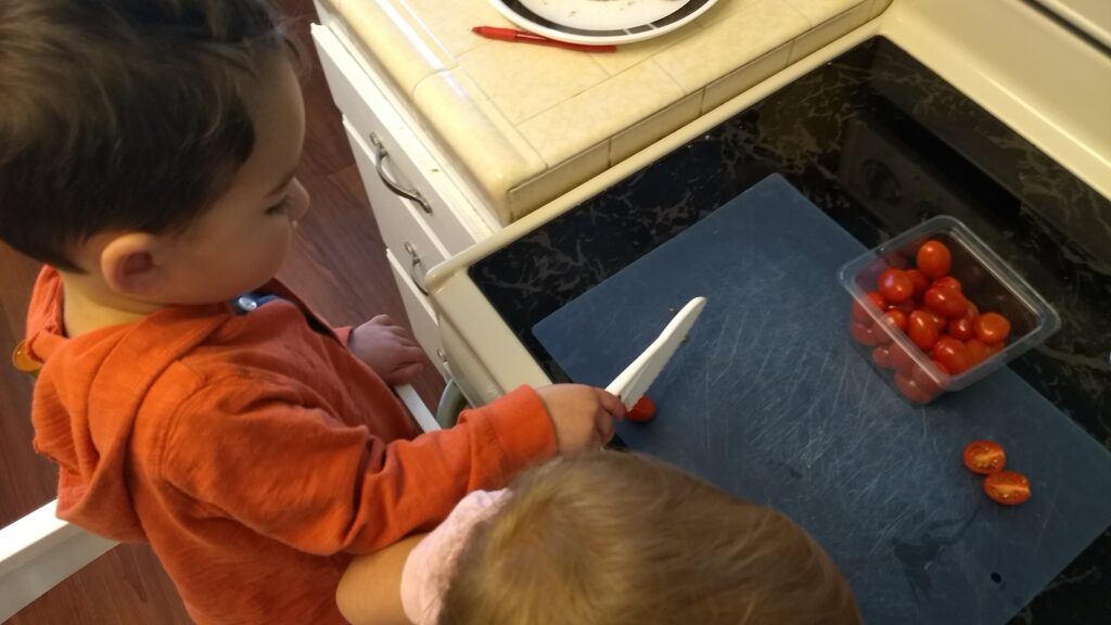 toddler using kid-safe knife