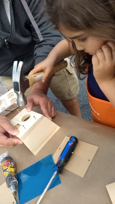 preschooler making a birdhouse at lowes