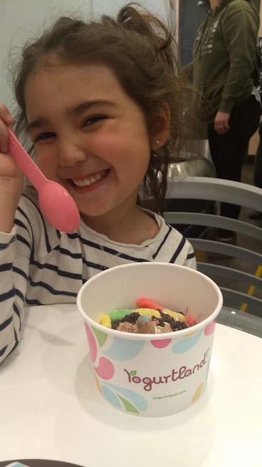 preschooler on a "date" at yogurtland