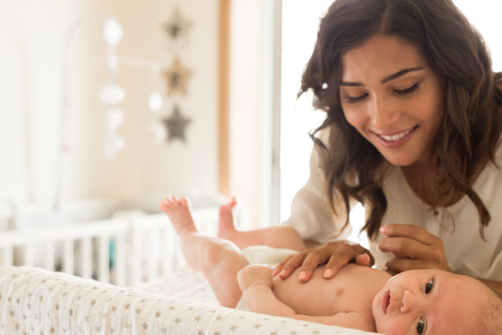 Mom with baby on changing table