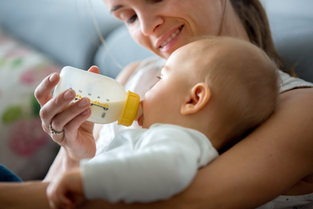 Mother feeding baby a bottle