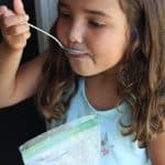 preschooler eating ice cream in a bag