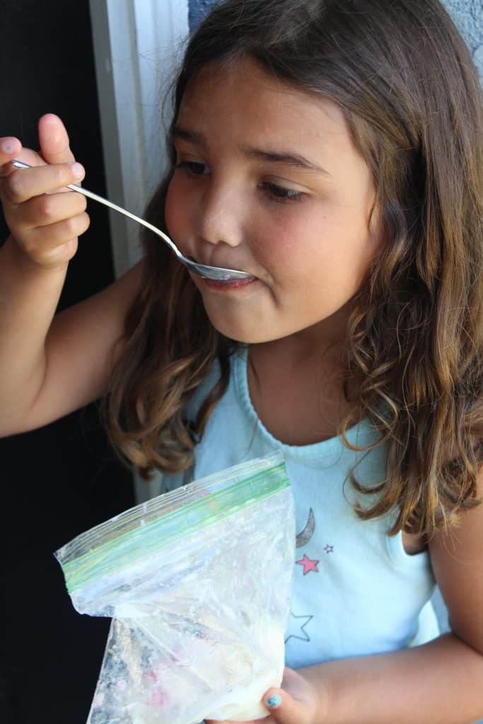 preschooler eating ice cream in a bag