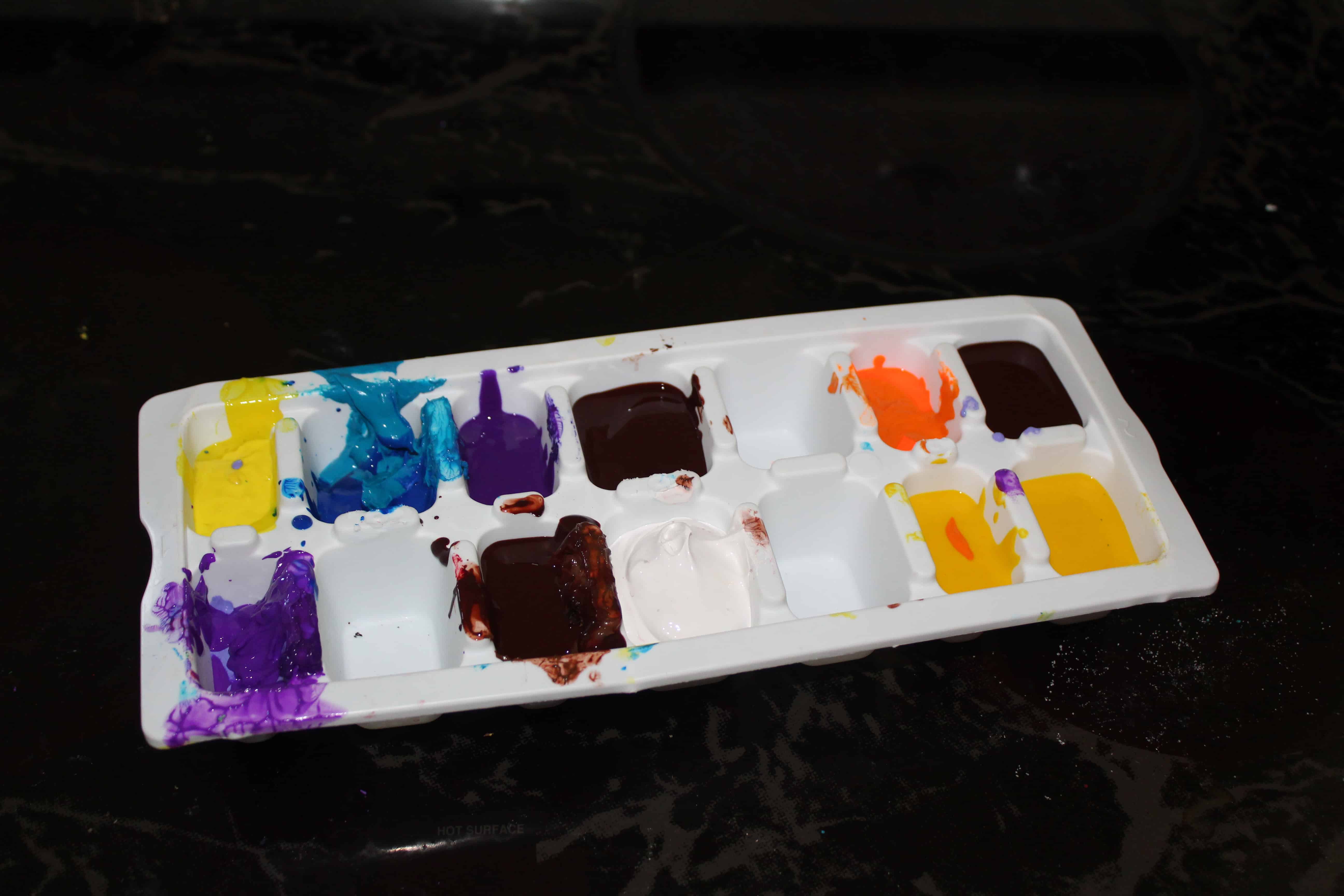 Ice tray with frozen ice "paints"