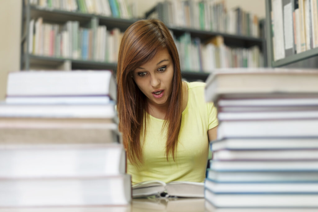 woman overwhelmed reading