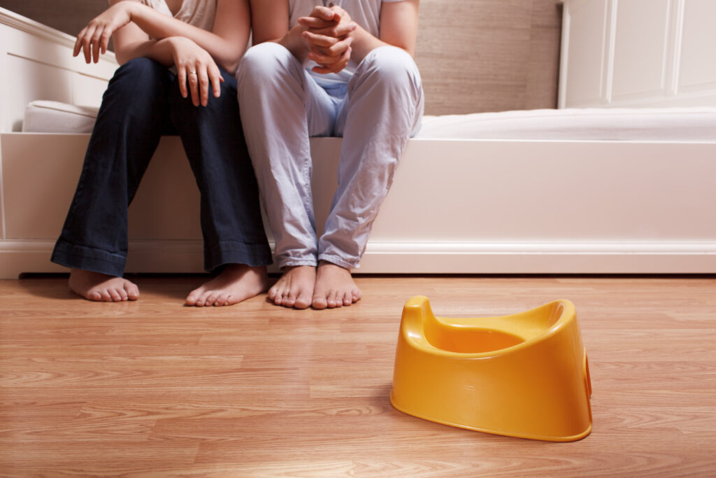 parents looking at a potty