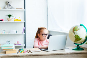 child attending school virtually