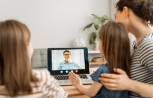 kids video chatting with their grandma