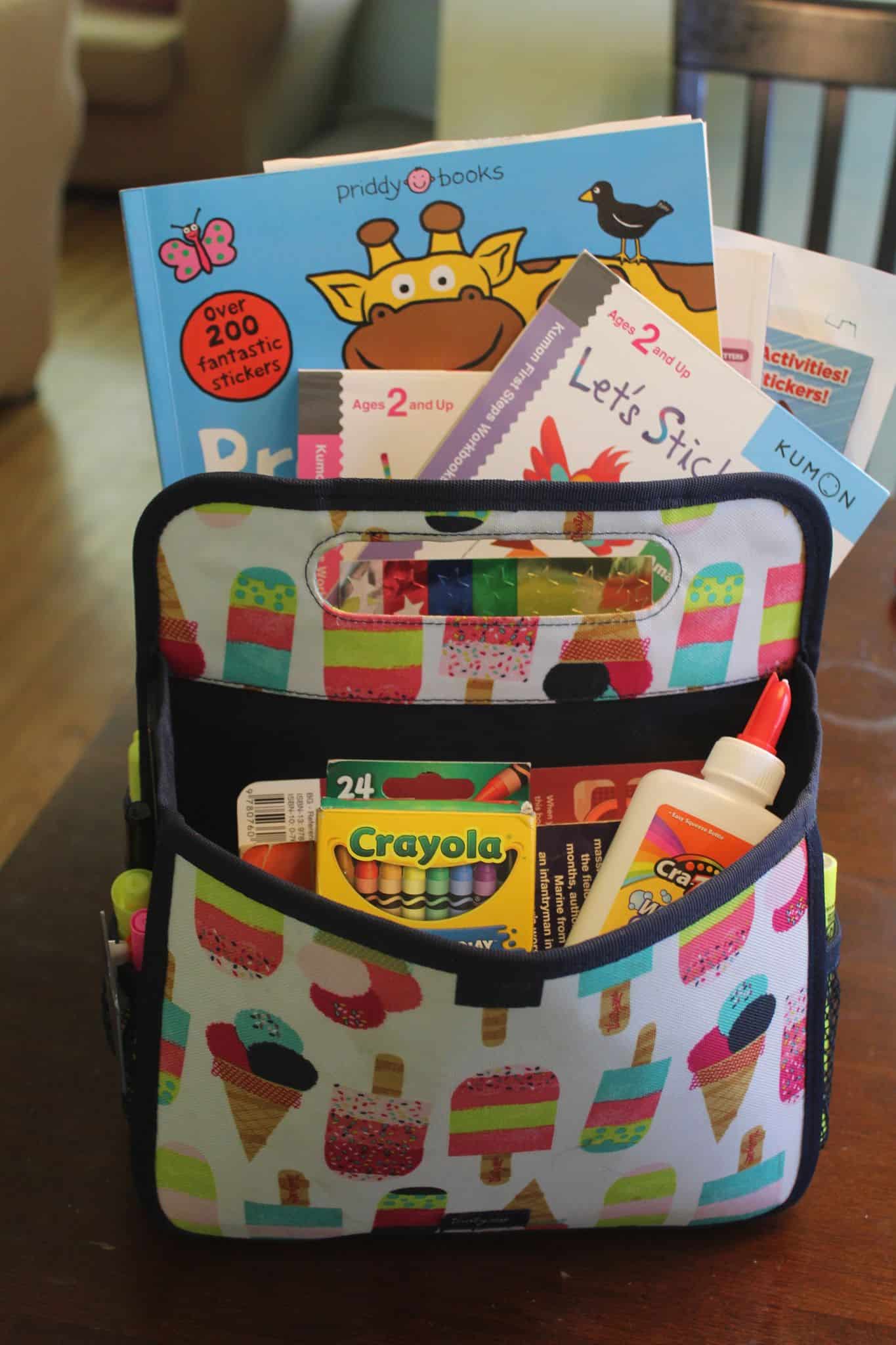 Double duty caddy pack from Thirty-one full of art and fun supplies to keep the kids busy