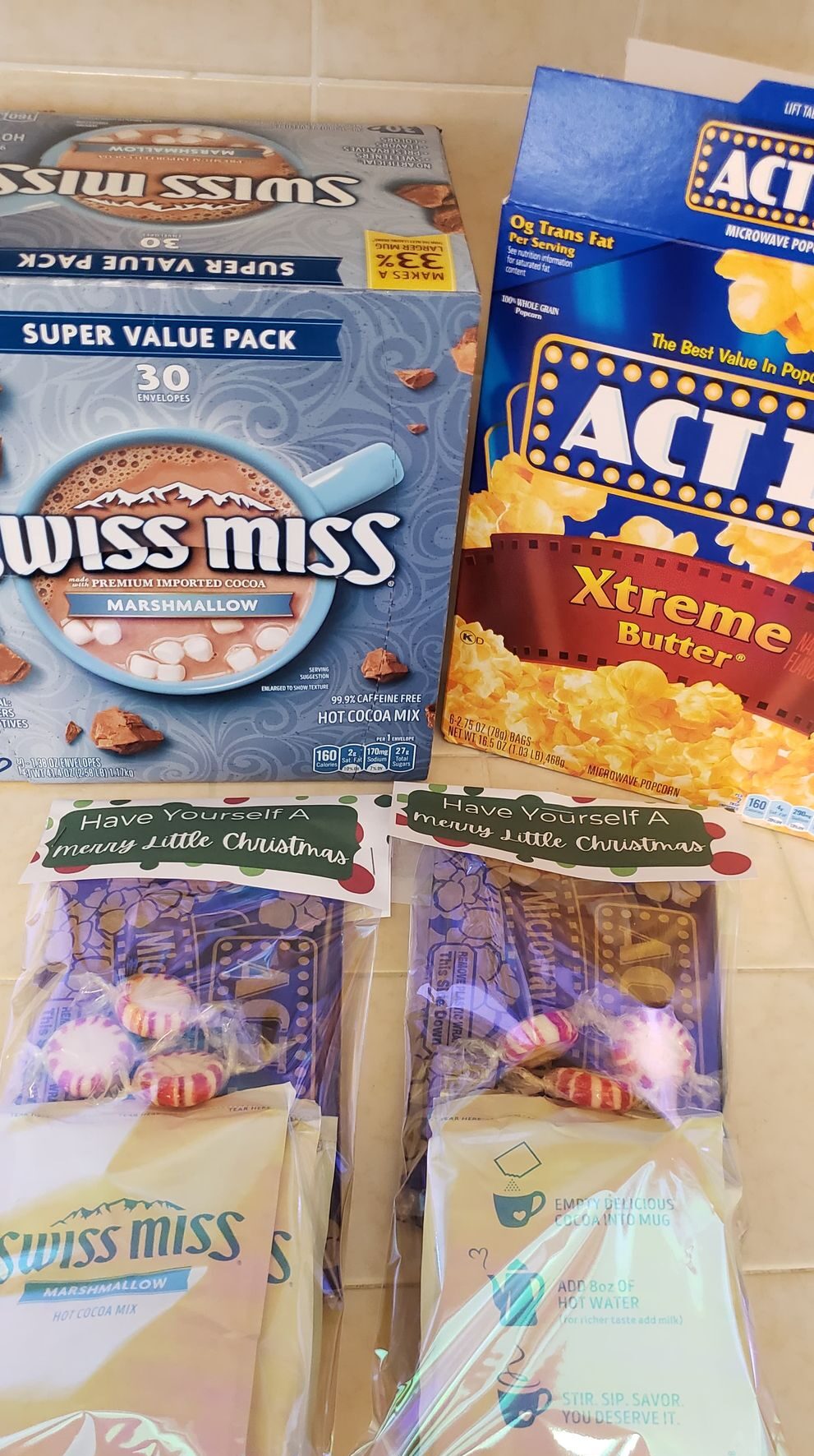 assembled christmas treat bags with popcorn and cocoa