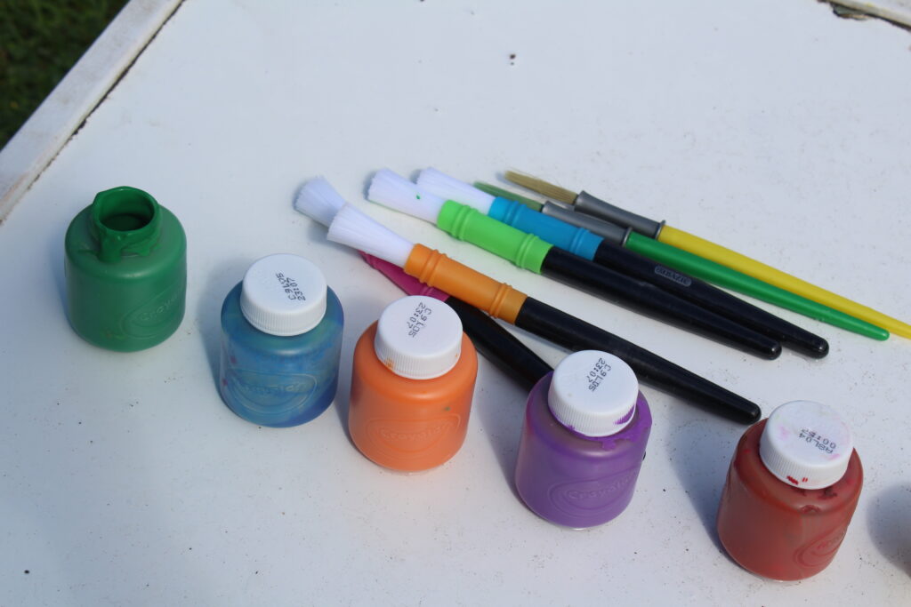 paints set up in ROYGBIV order