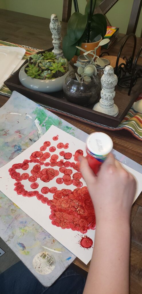 child using dot markers