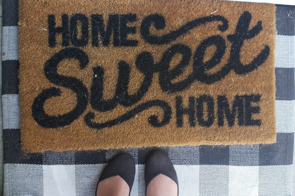 rothys by a door mat that reads "home sweet home"