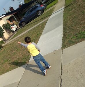 toddler pointing at friends house