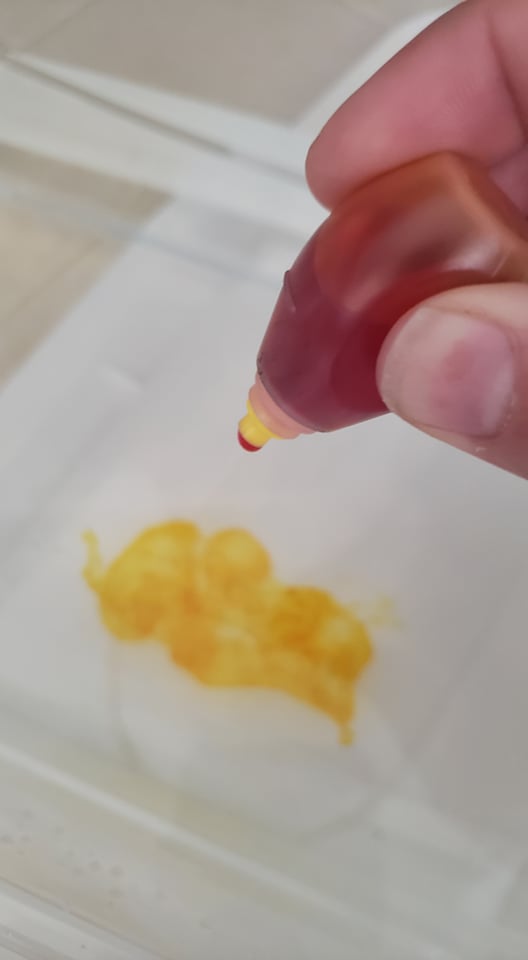 yellow food coloring in water