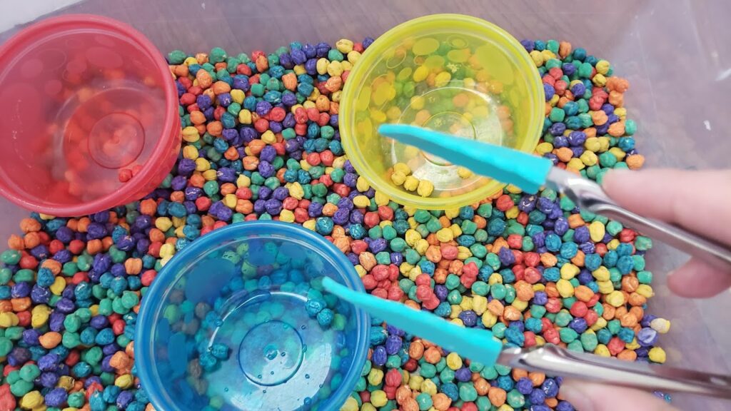 colorful chickpea sensory bin