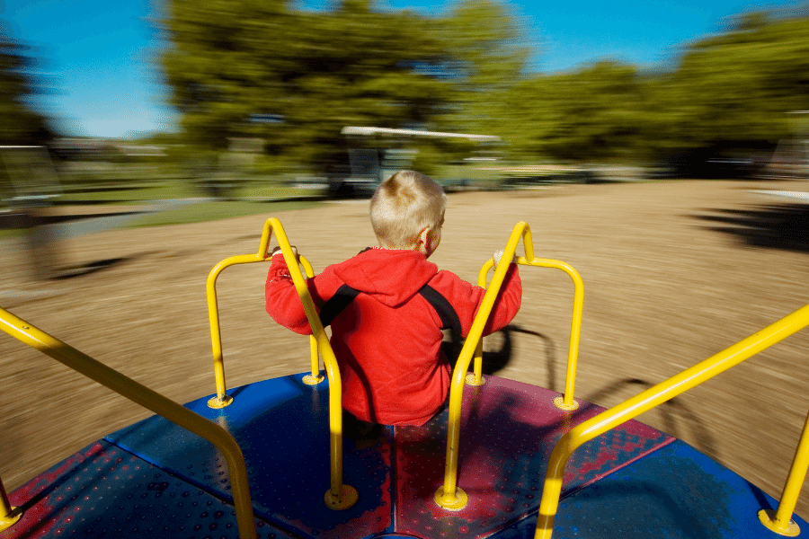 toddler on merry go round