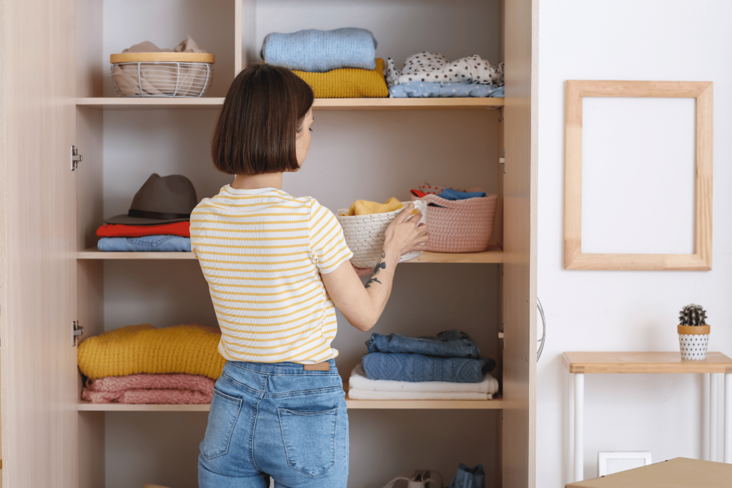 productive mom organizing closet