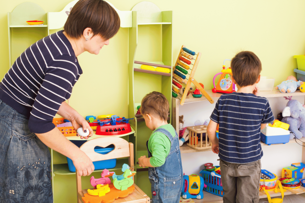 mom and kids cleaning toys