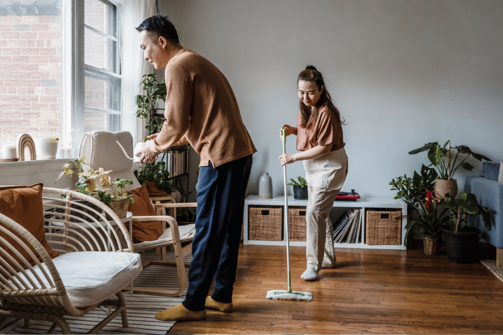 husband and wife cleaning together