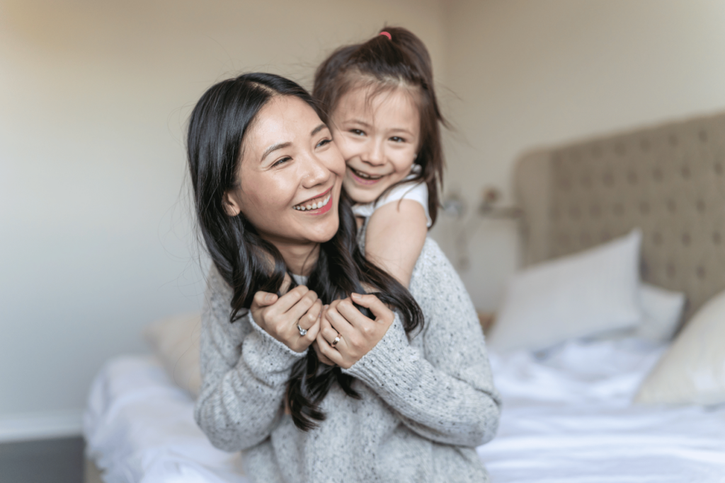 happy mom and daughter in a clean house